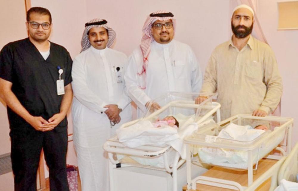 The proud father with his twins pose with the hospital staff. —
Courtesy photo
