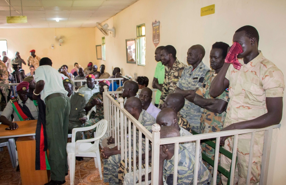 South Sudanese soldiers wait for their verdict at the military court in Juba, South Sudan, on Thursday. — AFP