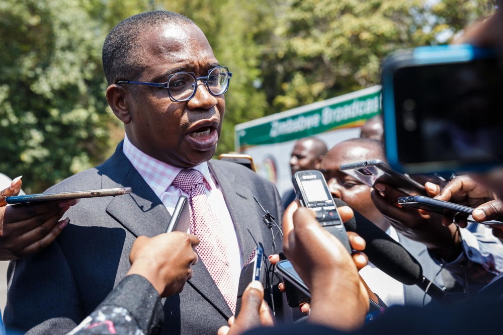 Minister of Finance and Economic Development, Professor Mthuli Ncube, speaks to the press after the swearing in ceremony for Zimbabwe’s new Cabinet ministers at State House, Harare, on Monday. — AFP