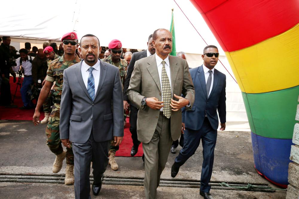 Eritrea’s President Isaias Afwerki and Ethiopia’s Prime Minister, Abiy Ahmed arrive for an inauguration ceremony marking the reopening of the Eritrean embassy in Addis Ababa, Ethiopia, in this July 16, 2018 file photo. — Reuters