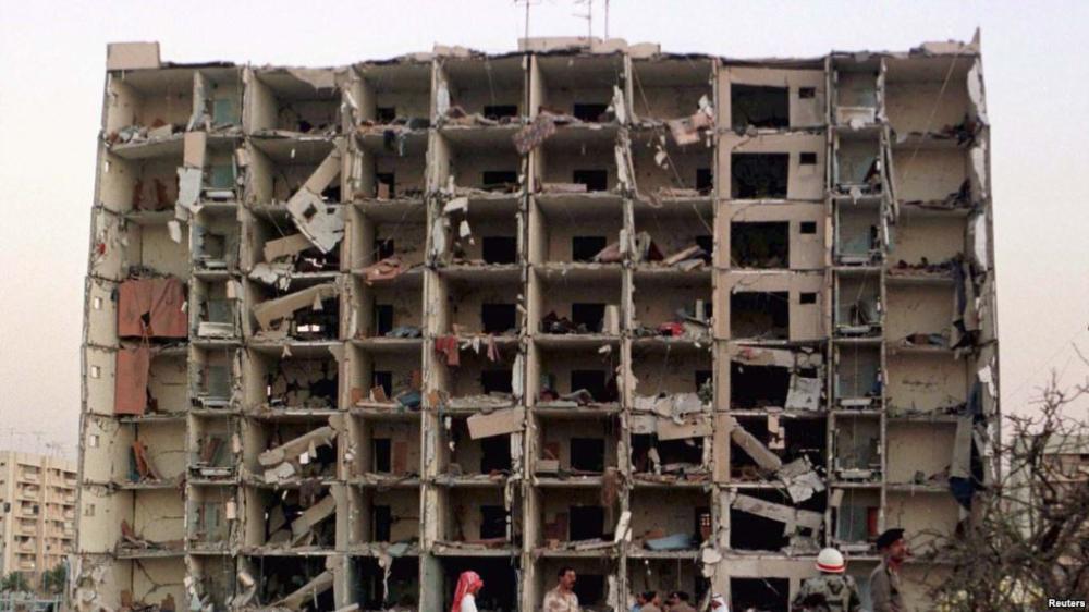 
US and Saudi investigators work into the night searching for clues outside the apartment building destroyed by a bomb at the Khobar Towers housing complex in Dhahran on June 25, 1996. — File photo