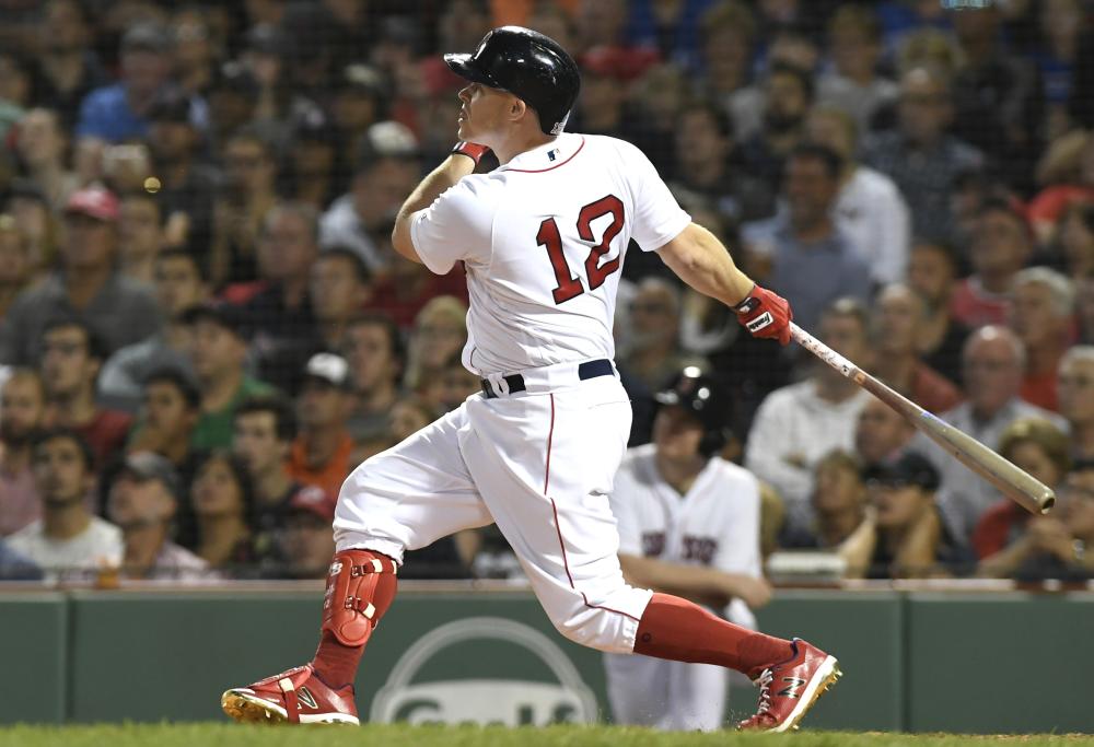 Boston Red Sox pinch hitter Brock Holt hits a three-run home run during the seventh inning against the Toronto Blue Jays at Fenway Park in Boston Tuesday. — Reuters 