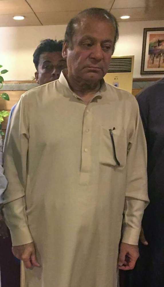 Jailed former Prime Minister Nawaz Sharif arrives in Lahore on Wednesday after being released temporarily on parole. — AFP