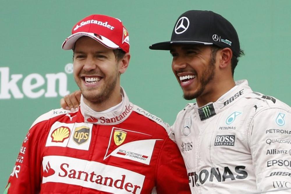 Sebastian Vettel (L) and Lewis Hamilton
