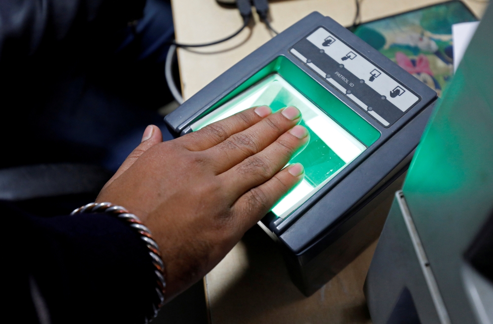 A woman goes through the process of finger scanning for the Unique Identification (UID) database system, also known as Aadhaar, at a registration center in New Delhi in this Jan. 17, 2018 file photo. — Reuters