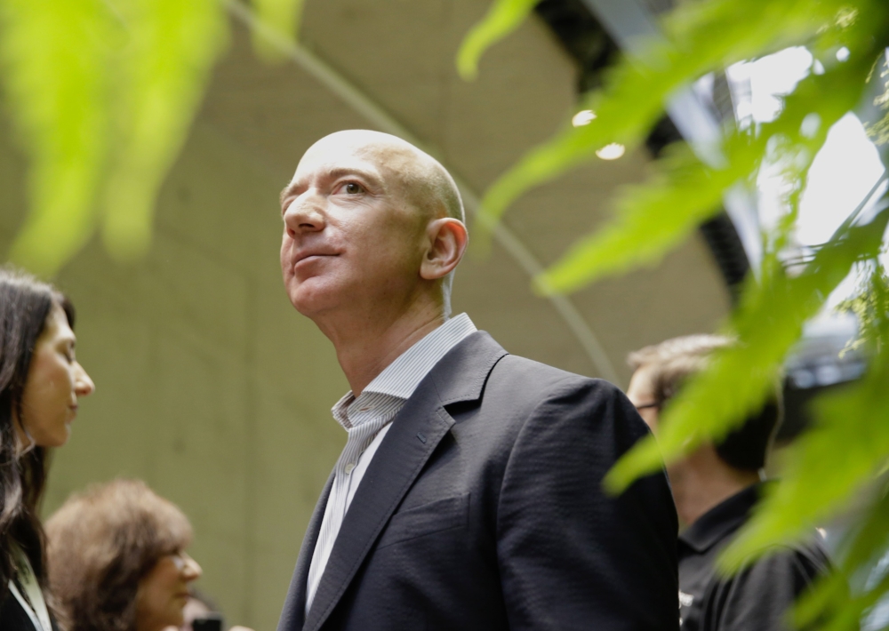 In this file photo, Chief Executive Officer of Amazon, Jeff Bezos, tours the facility at the grand opening of the Amazon Spheres, in Seattle, Washington. Bezos announced thursday he was launching a philanthropic fund with a $2 billion initial commitment to help homeless families and launch preschools in low-income communities. — AFP