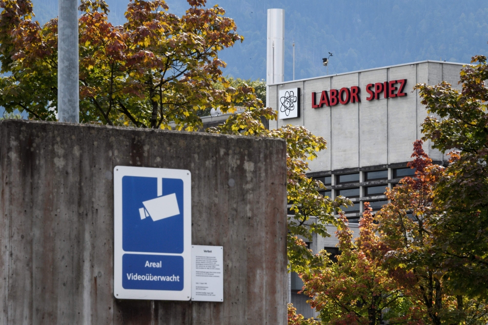 A sign warning of CCTV area controlled is seen next to the Spiez Laboratory, Swiss Federal Institute for NBC-Protection (nuclear, biological, chemical), in Spiez, 40 km from the capital Bern, on Friday. — AFP 