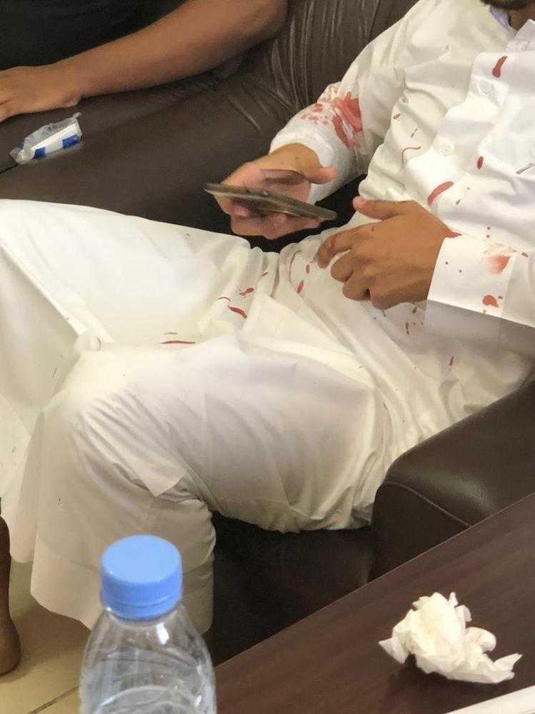 The Taif teacher in blood-stained clothes after the classroom attack.