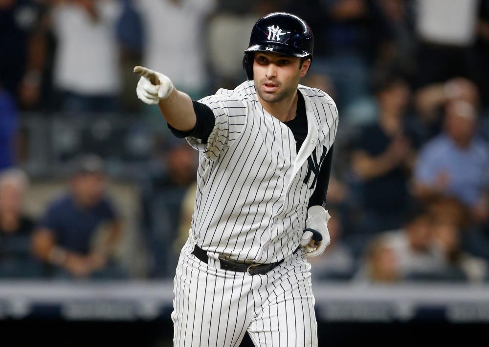


Neil Walker of the New York Yankees reacts after his seventh inning three-run home run against the Boston Red Sox at Yankee Stadium in New York City Tuesday. — AFP 