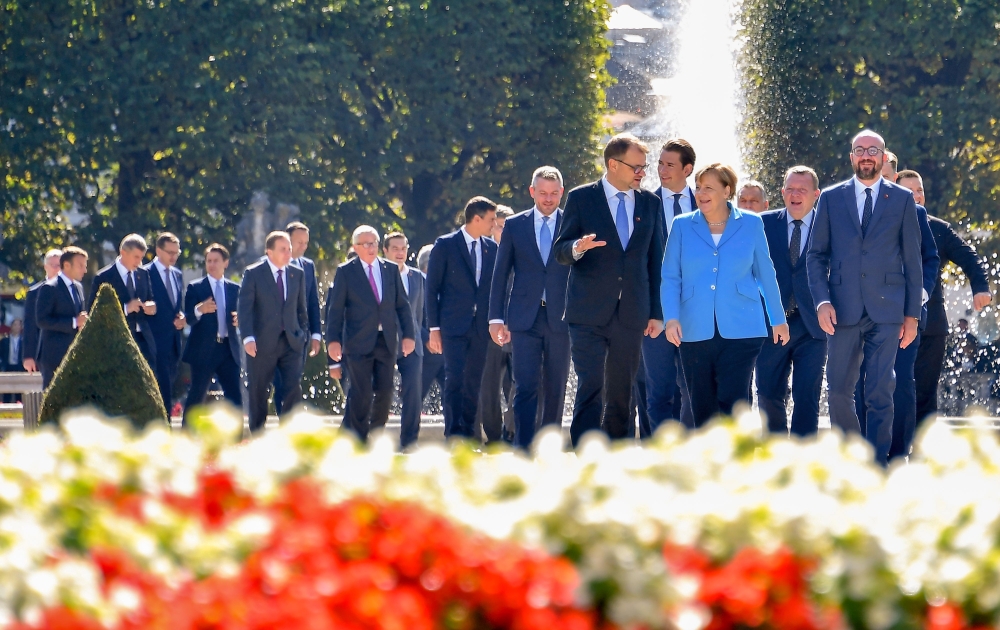 German Chancellor Angela Merkel walks with Finland’s Prime minister Juha Sipila, Austria’s Chancellor Sebastian Kurz, Denmark’s Prime Minister Lars Lokke Rasmussen and Belgium’s Prime Minister Charles Michel, on their way to pose for a family photo at the Mozarteum University during the EU Informal Summit of Heads of State or Government in Salzburg, Austria, on Thursday. — AFP