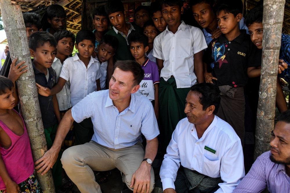 Britain’s Foreign Secretary Jeremy Hunt meets with local Muslim residents in Maungdaw in Rakhine state, Myanmar, on Thursday. — Reuters