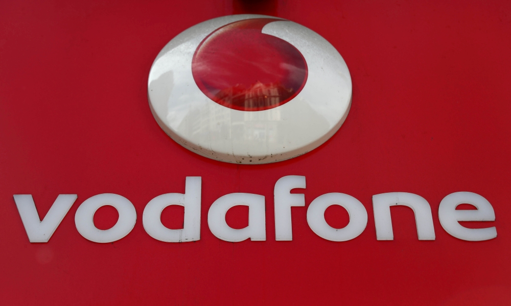 A branded sign is displayed on a Vodafone store in London, Britain, in this file photo. — Reuters