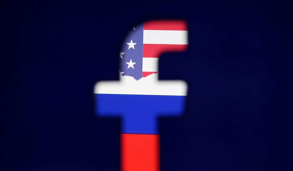 File photo shows a 3D printed Facebook logo is seen in front of a displayed American and Russian flag in this photo illustration. — Reuters