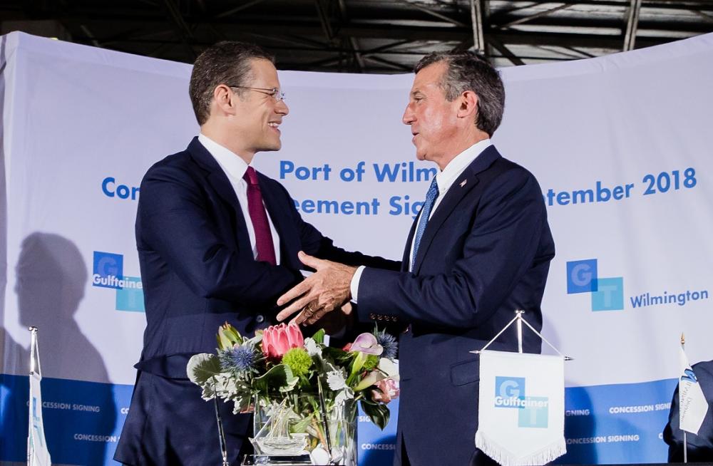 



Gov. John Carney (right), Governor of the State of Delaware, shakes hands with Badr Jafar, Chairman of Gulftainer’s Executive Board, at the signing of agreement