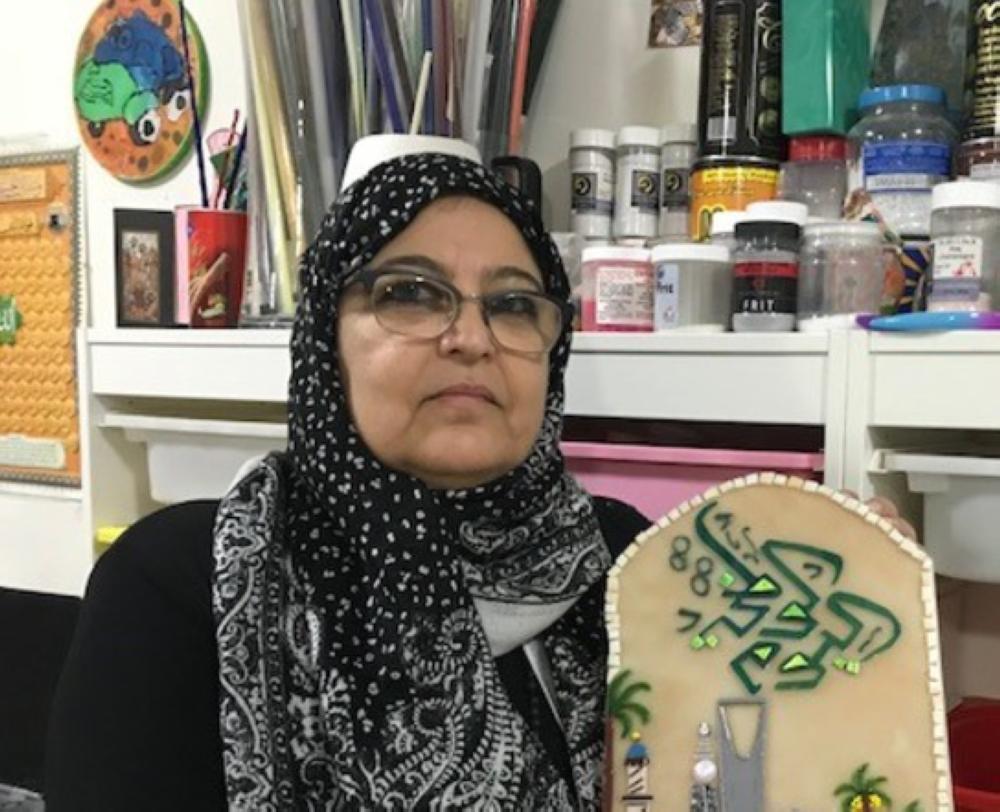 


Hala Al-Khudairy works from her workshop inside her home.