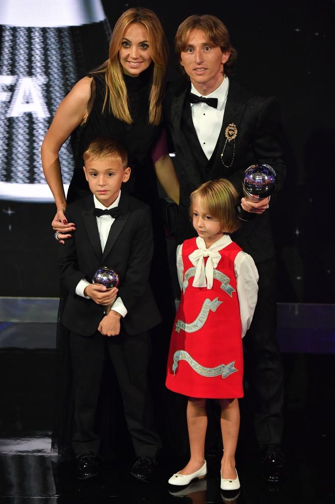 France's coach Didier Deschamps (C), winner of the Best FIFA Men's Coach of 2018 Award, is flanked by Orlando Pride and Brazil forward Marta (R) and Real Madrid and Croatia midfielder Luka Modric (L) winners of the Best FIFA Women's and Men's Player of 2018 Award, as they pose for a photograph with their trophies during The Best FIFA Football Awards ceremony, on September 24, 2018 in London. — AFP