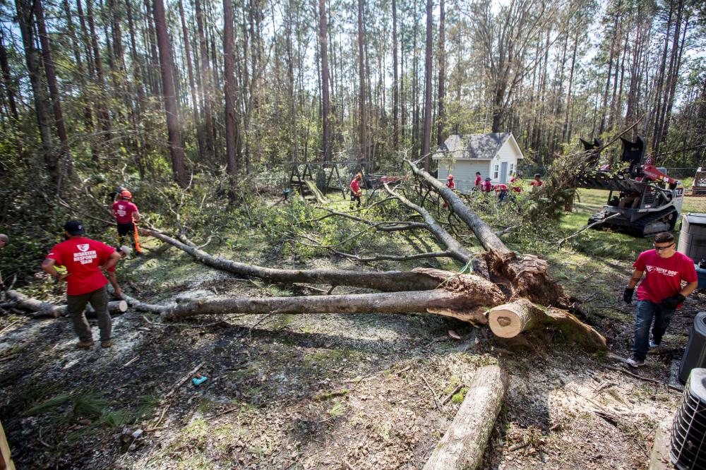 


US Marines and volunteers with Sheep Dog Impact Assistance organization remove branches and remains of a fallen tree from an area impacted by Hurricane Florence in Wilmington, North Carolina, in this Sept. 22, 2018 file photo. — Reuters