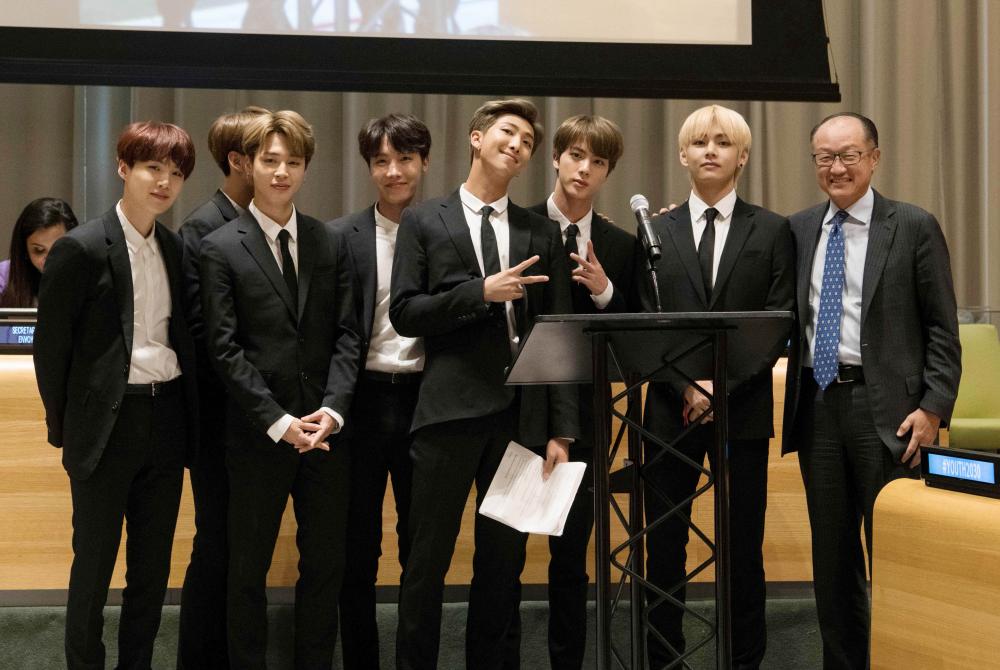 


In this photo released by the United Nations, K-Pop band BTS poses for a photo with World Bank President Jim Yong Kim, right, during a meeting focused on youth issues at the United Nations in New York on Tuesday. - AFP