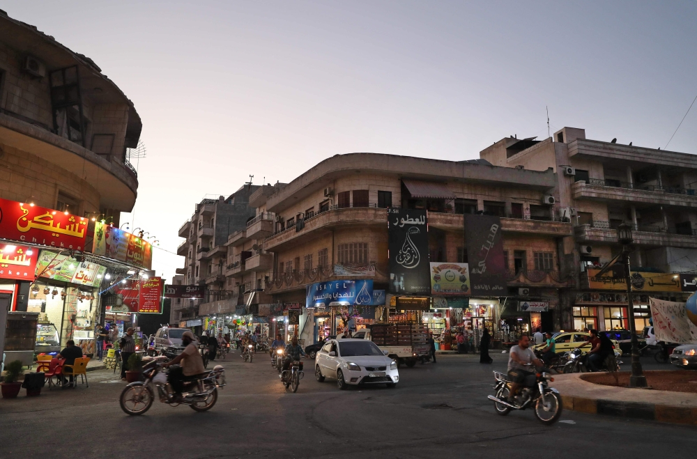 


A general view shows a busy intersection in the center of the northwestern Syrian city of Idlib. — AFP