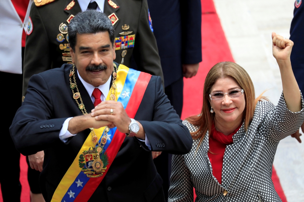 Venezuelan President Nicolas Maduro and his wife Cilia Flores gesture during arrival for a special session of the National Constituent Assembly to take oath as re-elected President at the Palacio Federal Legislativo in Caracas, Venezuela, in this May 24, 2018 file photo. — Reuters