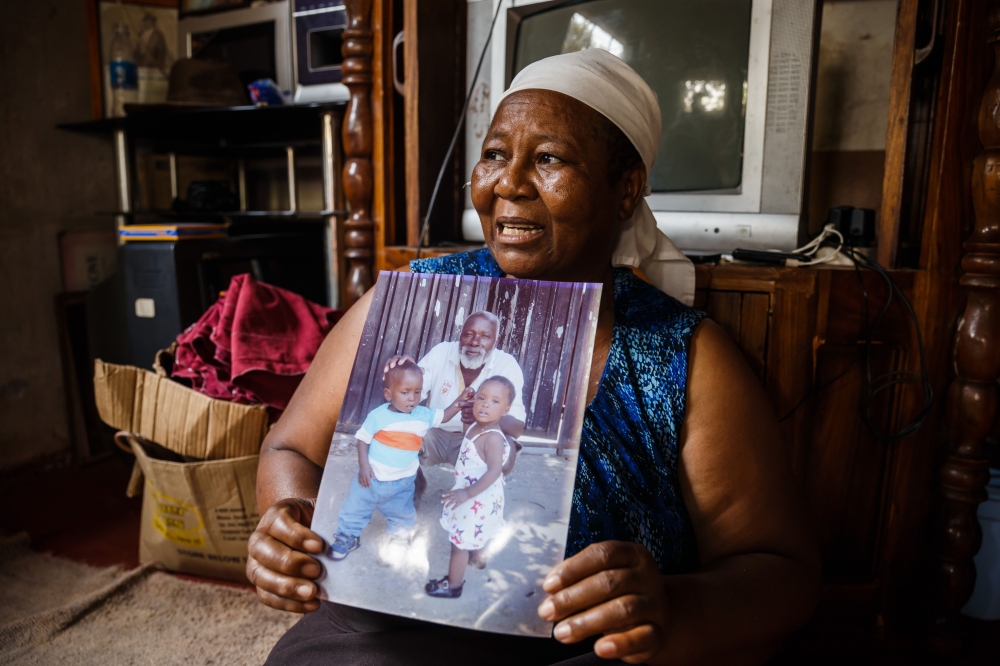 Emma Zhakata holds a picture of her late husband, Wonder, who fell ill from cholera and died in a few hours in Glen View, a suburb of Zimbabwe’s capital Harare where the outbreak was first detected, in this Sept. 19, 2018 file photo. — AFP