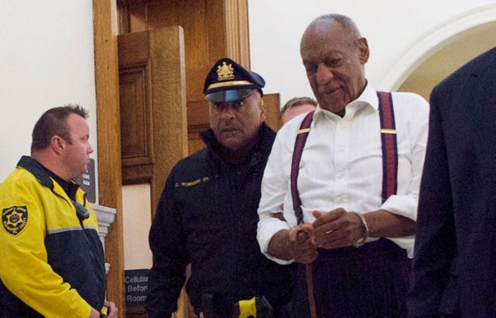 Comedian Bill Cosby is taken into custody in handcuffs at Montgomery County Courthouse in Norristown, Pennsylvania on Wednesday after being sentenced to at least three years in prison and branded a “sexually violent predator” for assaulting a woman at his Philadelphia mansion 14 years ago. - AFP