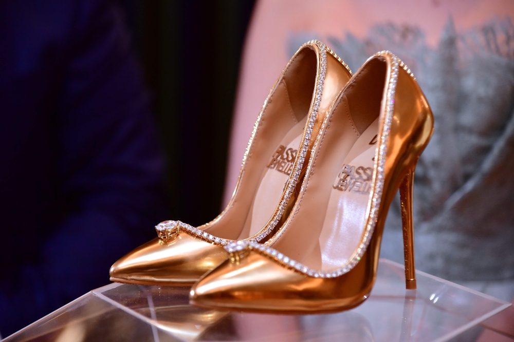 A pair of shoes worth $17 millionare seen on display at Burj Al Arab during the launch presentation in Dubai on Thursday. The Passion Diamond Shoes, features hundreds of diamonds, together with two imposing D-flawless diamonds of 15 carats each. — AFP