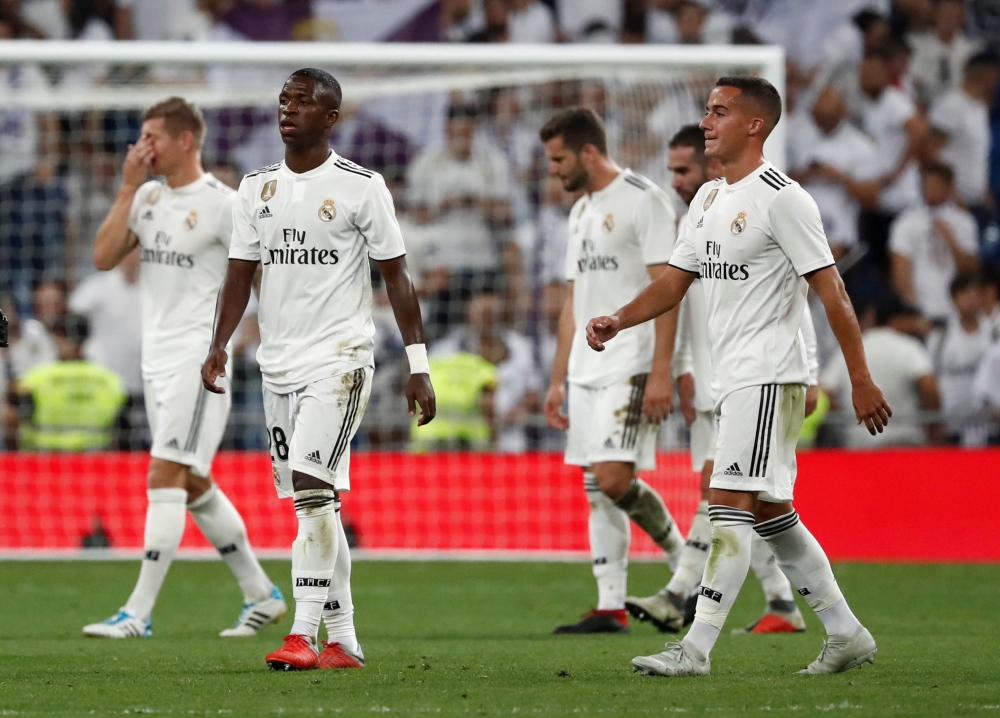 


Real Madrid’s players leave the ground after La Liga match against Atletico Madrid at Santiago Bernabeu, Madrid, Saturday. — Reuters