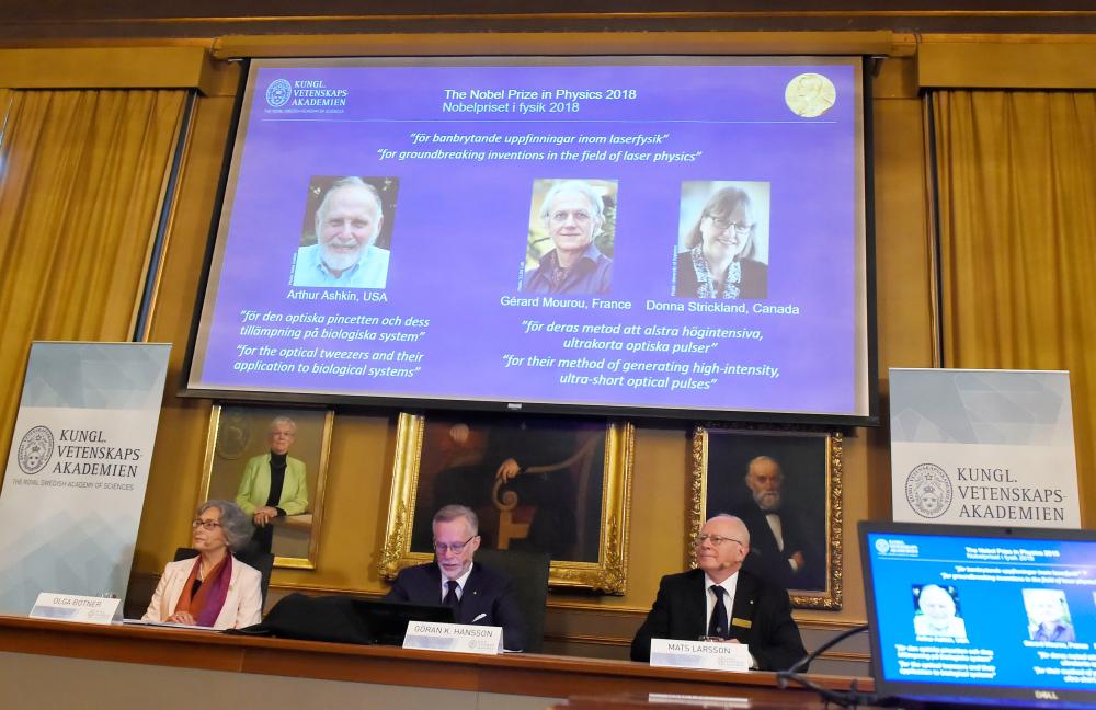 


The Nobel Prize laureates for physics 2018 Arthur Ashkin of the United States, Gerard Mourou of France and Donna Strickland of Canada are announced at the Royal Swedish Academy of Sciences in Stockholm, Sweden, on Tuesday. — Reuters