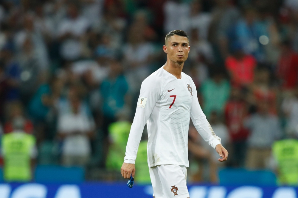 In this file photo Portugal's forward Cristiano Ronaldo reacts to his team's loss during the Russia 2018 World Cup round of 16 football match between Uruguay and Portugal at the Fisht Stadium in Sochi. Ronaldo has been left out of Portugal's next four internationals, the national coach Fernando Santos said Thursday. — AFP