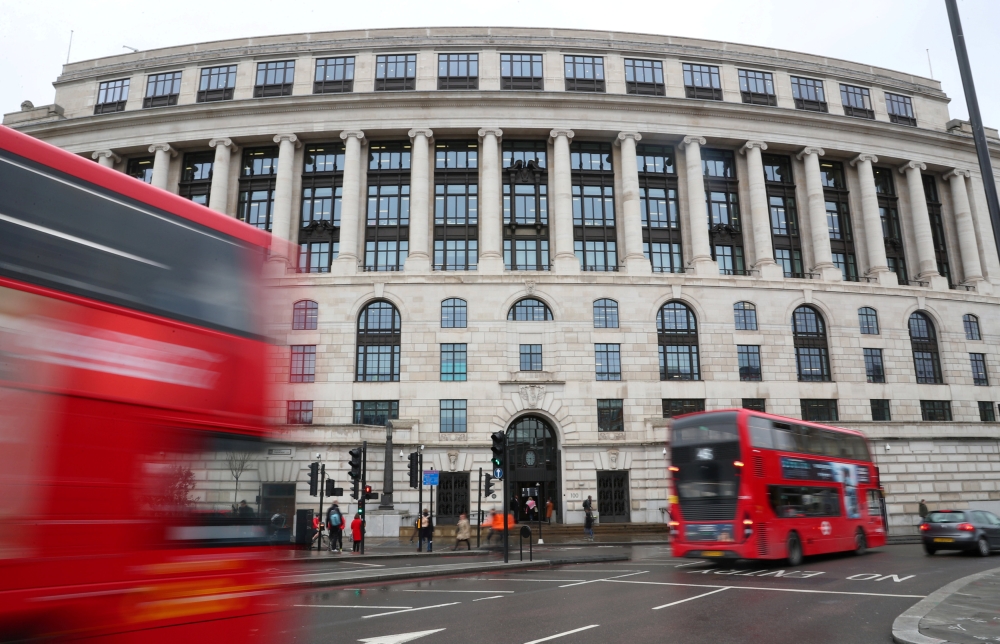 Traffic and people pass by the front of the Unilever building in central London, Britain, in this file photo. — Reuters