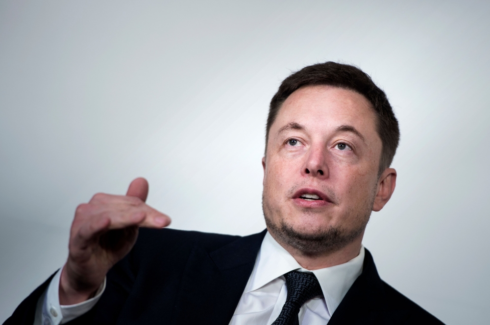 In this file photo Elon Musk, CEO of SpaceX and Tesla, speaks during the International Space Station Research and Development Conference at the Omni Shoreham Hotel in Washington, DC. Less than a week after settling fraud charges with the US Securities and Exchange Commission, Musk on Thursday derided the agency on Twitter.