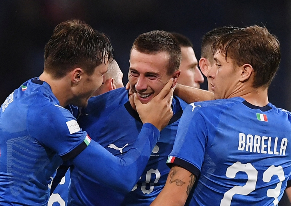 Italy's Federico Bernardeschi celebrates after scoring their first goal with teammates during the friendly match against Ukraine at Stadio Comunale Luigi Ferraris, Genoa, Italy, on Wednesday. — Reuters