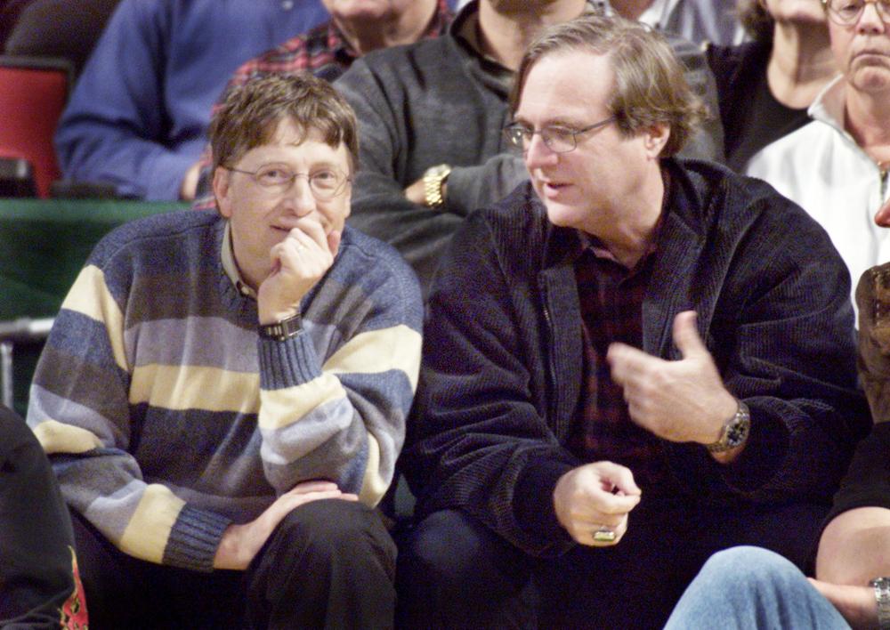 


Microsoft co-founders Bill Gates, left, and Paul Allen, right, chat at  court side during the NBA game between the Seattle SuperSonics and the Portland Trailblazers at Key Arena in Seattle in this March 11, 2003 file photo. — Reuters