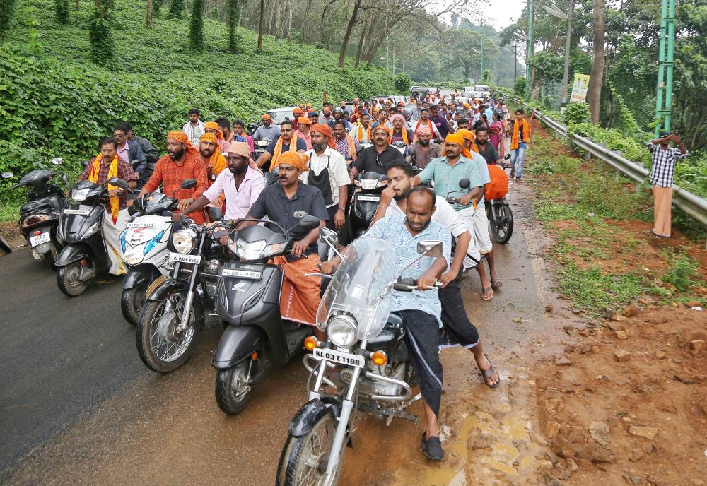 


Hindu devotees take part in a motorcycle rally as part of a protest against the lifting of ban by Supreme Court that allowed entry of women of menstruating age to the Sabarimala temple, at Nilakkal Base camp in Pathanamthitta district in the southern state of Kerala, India, on Tuesday. — Reuters