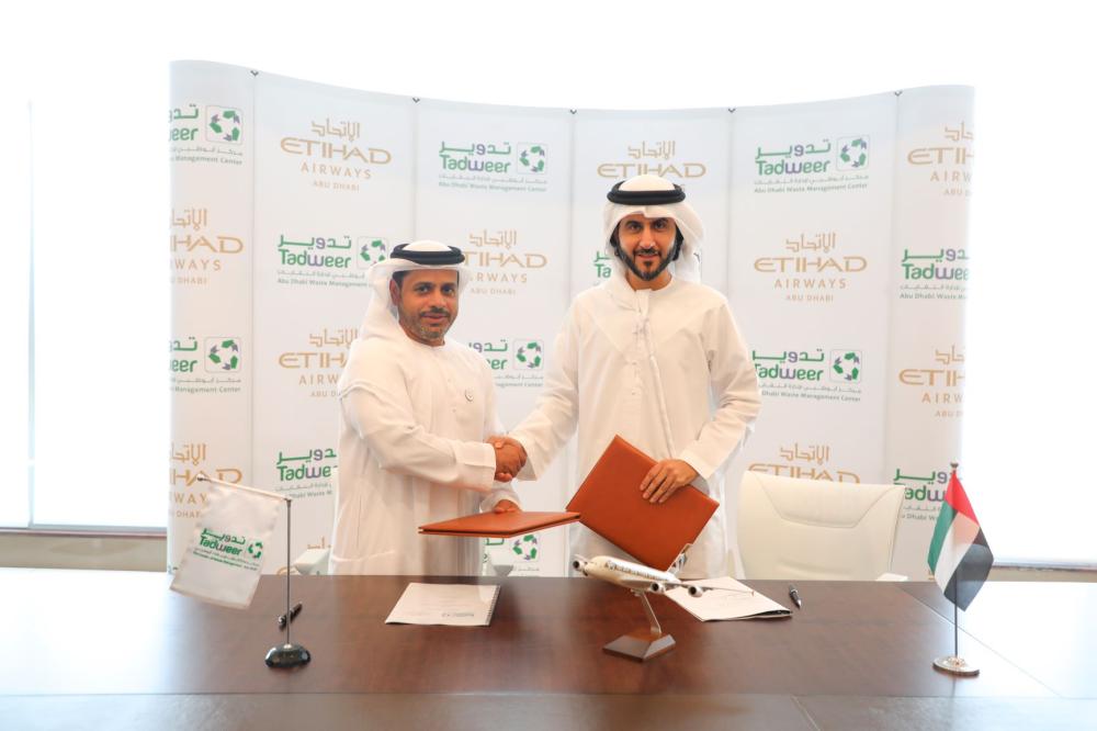 


Dr Salem Al Kaabi, acting General Manager of Tadweer, and Mohammad Al Bulooki, Chief Operating Officer at Etihad Aviation Group, shake hands after the signing of agreement