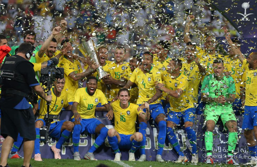 Brazilian players celebrate after winning the international friendly match against Argentina at the King Abdullah Sport City Stadium in Jeddah Tuesday. — AFP