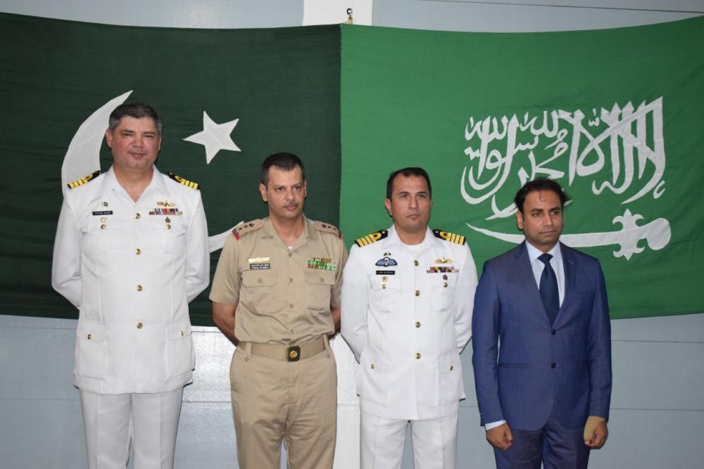 


Acting Consul General of Pakistan Shaiq Bhutto (R) with representative of the Saudi Royal Naval Force (2nd L) and officers of PNS Saif on board the ship.