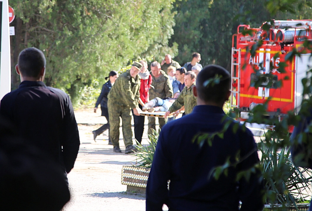 Emergency services help injured persons after a fatal attack on a college in the port city of Kerch, Crimea, on Wednesday. — Reuters