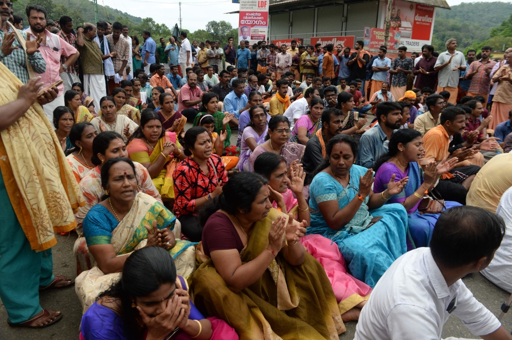 Indian Hindu activists block a road to the Sabarimala Temple, at Vadaserikara town in Pathanamthitta district in India’s southern Kerala state on Friday. — AFP