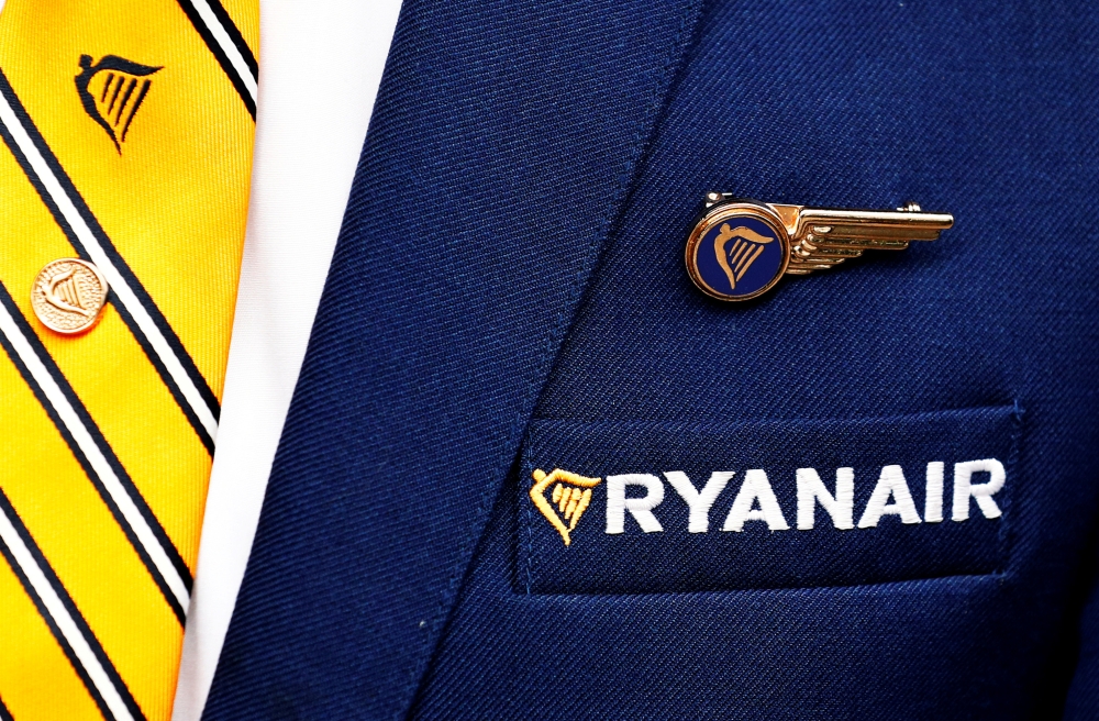 Ryanair logo is pictured on the the jacket of a cabin crew member ahead of a news conference by Ryanair union representatives in Brussels, Belgium in this recent photo. — Reuters