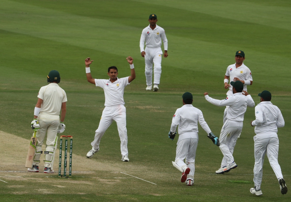Pakistan bowler Mohammad Abbas (2R) celebrates after dismissing Australian cricketer Marnus Labuschagne during day four of the second Test match between Australia and Pakistan at Sheikh Zayed Stadium in Abu Dhabi on Friday. — AFP