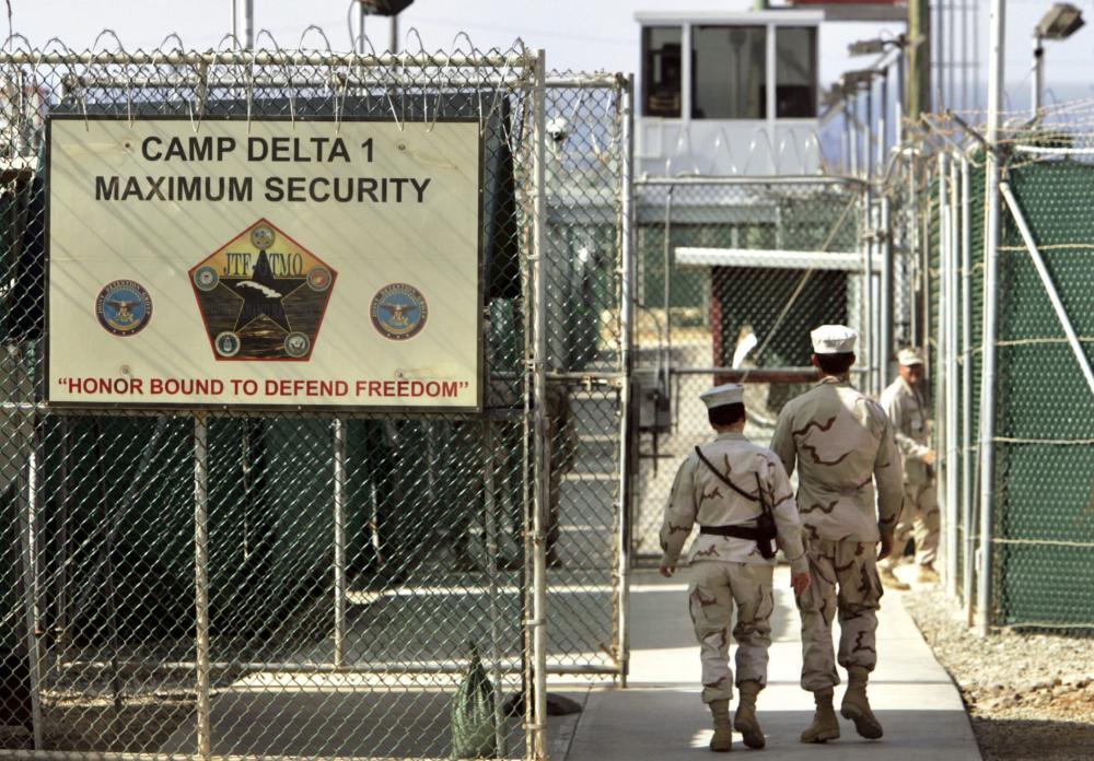 US military guards walk within Camp Delta military-run prison, at the Guantanamo Bay US Naval Base, Cuba, in this file photo — AP