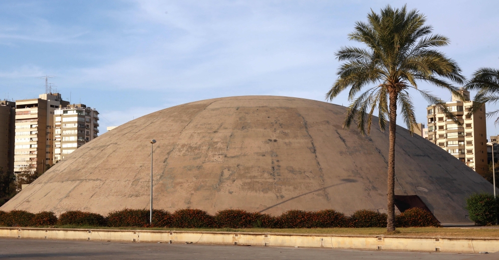 


A view of an arched structure in the grounds of the Tripoli International Fair, close to the seafront of the northern Lebanese port city. Close to the seafront in Lebanon’s Tripoli, giant curves of concrete stand testimony to the tiny Mediterranean country 1960s hopeful space program, when it successfully launched a small rocket without an astronaut into space. — AFP photos