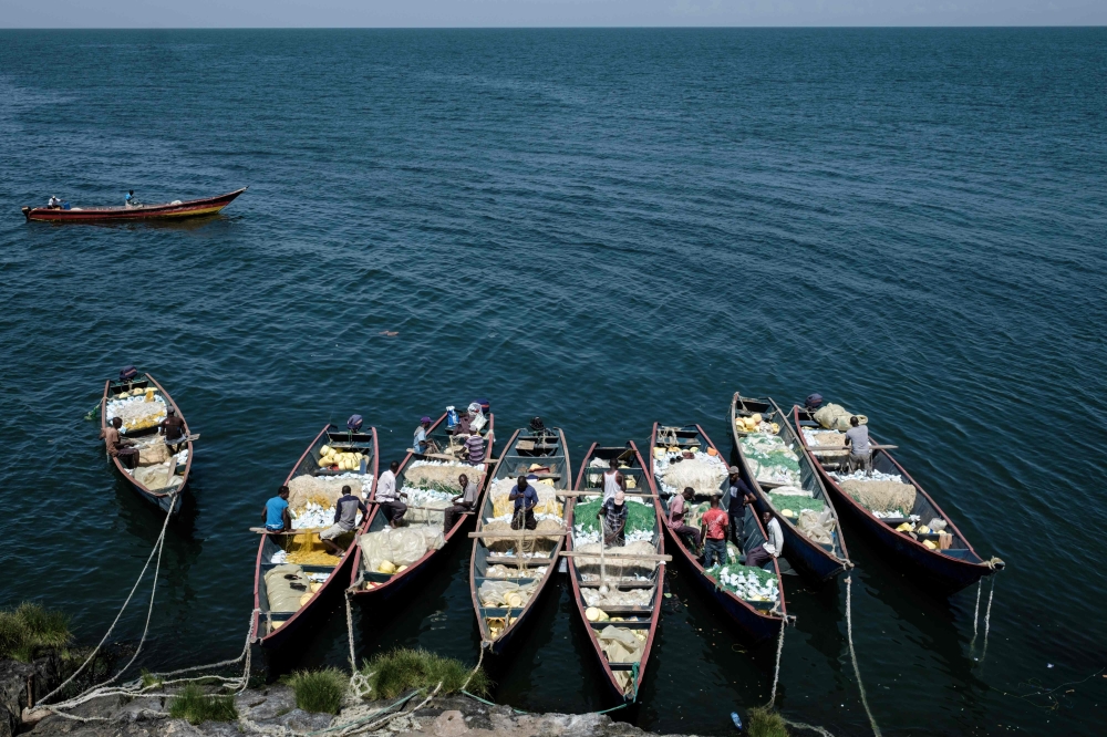 


The picture tshows a general view of Migingo island which is densely populated by residents fishing mainly for Nile perch in Lake Victoria on the border of Uganda and Kenya. A rounded rocky outcrop covered in metallic shacks, Migingo Island rises out of the waters of Lake Victoria like an iron-plated turtle. — AFP