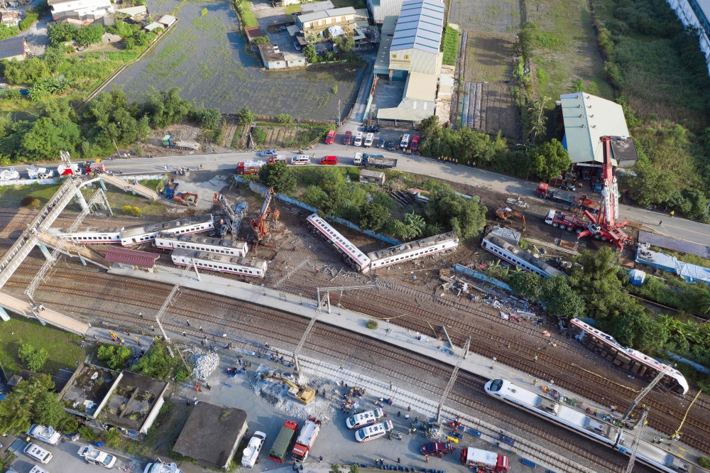 A general view shows carriages of the Puyuma Express train in Taiwan’s northeastern Yilan county on Monday, a day after the train derailed at high speed near Xinma station. — AFP