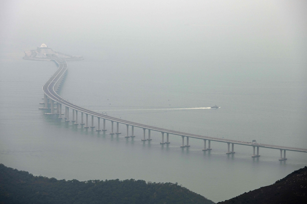 This general view shows a police boat patrolling waters around a section of the Hong Kong-Zhuhai-Macau Bridge (HKZM) in Hong Kong on Tuesday. — AFP