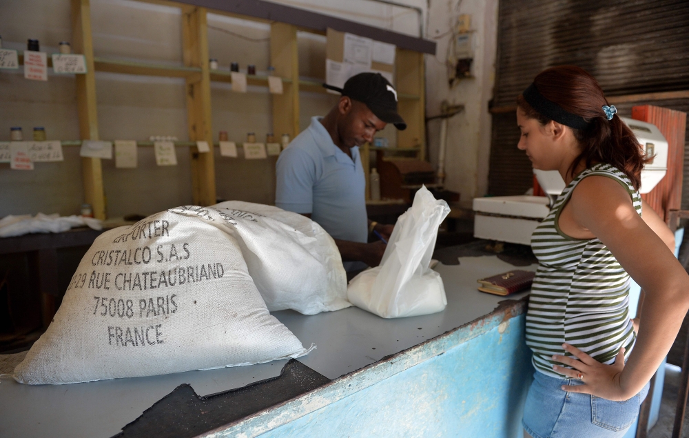 A man weighs sugar produced in France at a grocery store in Havana, Cuba, in this Oct. 9, 2018 file photo. — AFP