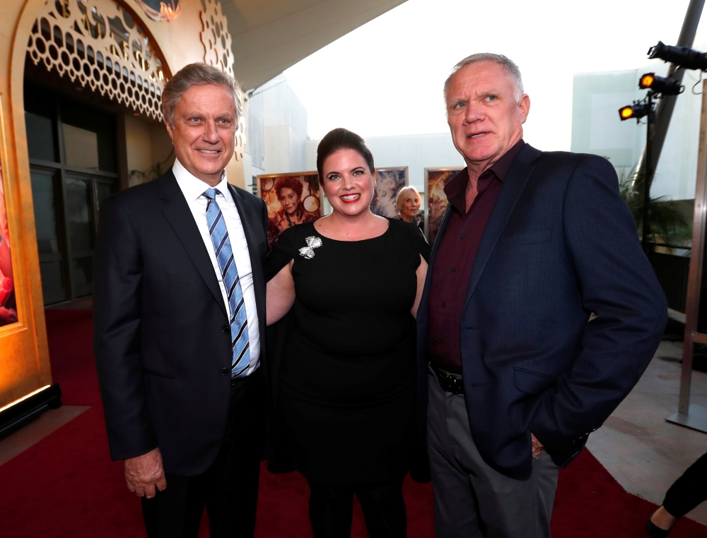 Directors Lasse Hallstrom (L) and Joe Johnston pose with executive producer Lindy Goldstein at the premiere for 