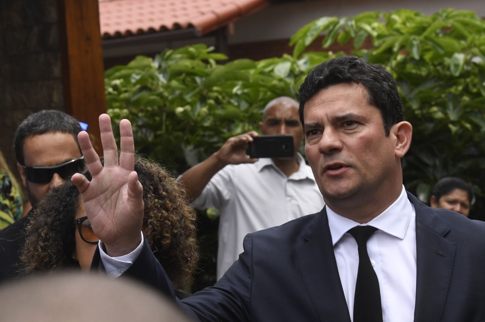 Brazilian Judge Sergio Moro gestures as he leaves the house of Brazilian President-elect Jair Bolsonaro after a meeting, in Rio de Janeiro, Brazil on Thursday. — AFP